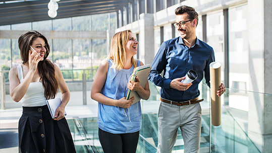 Colleagues laughing at work